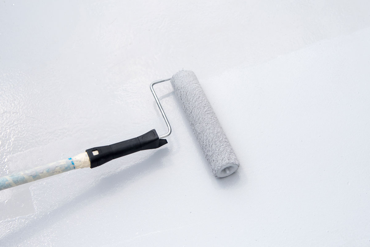 Paint roller on white surface