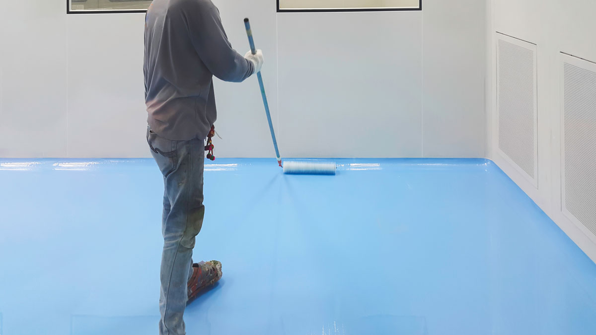 Person painting blue floor