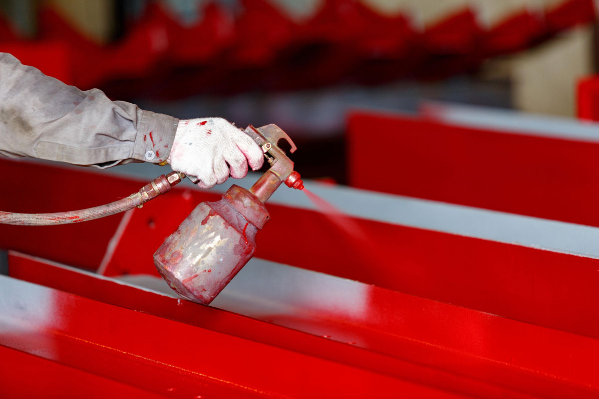 Spraying paint on metal surface